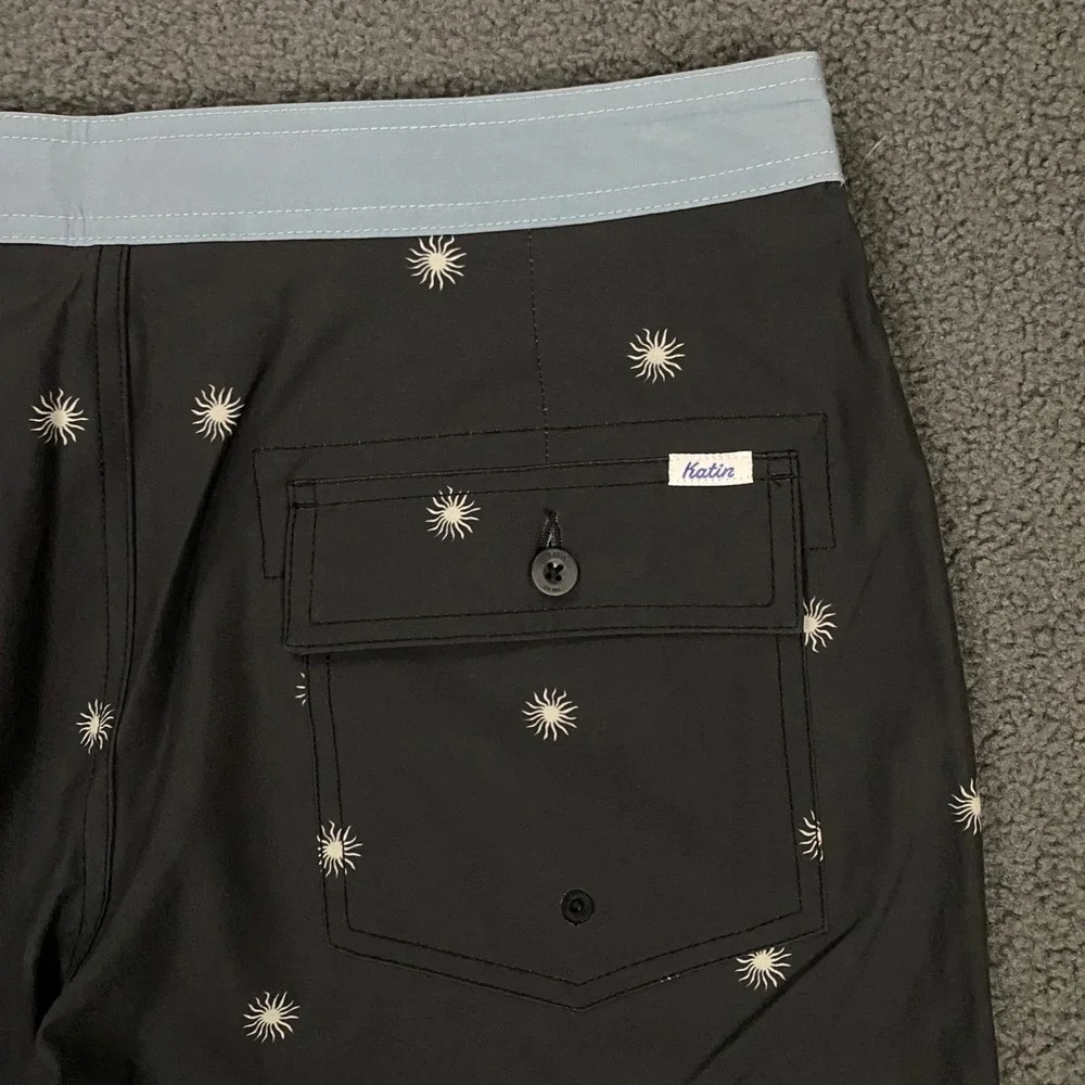 NWOT Katin Black Swim Hybrids with Light Blue Waistband & White Starburst Print